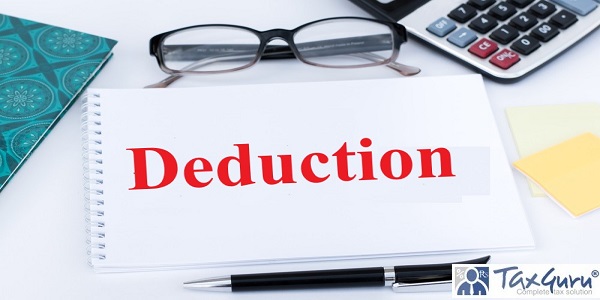 Text Tax Deductions on white notepad on office desk