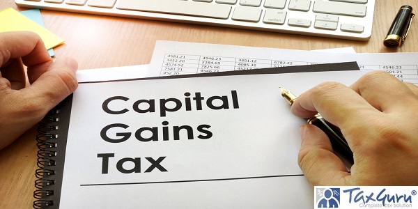 Hands holding documents with title capital gains tax CGT
