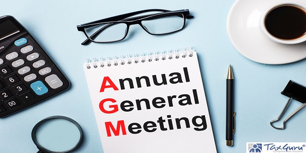 On a blue background, glasses, calculator, coffee, magnifier, pen and notebook with the text Annual General Meeting