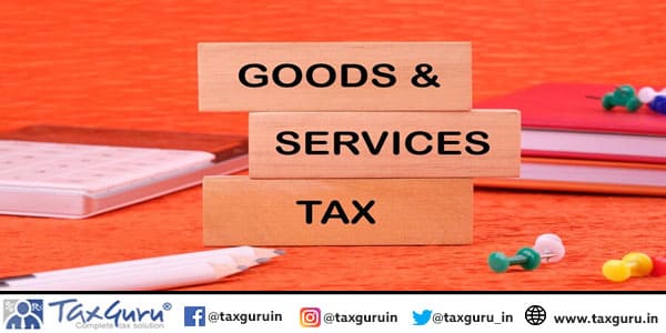 Goods and services and tax text written on a wooden block